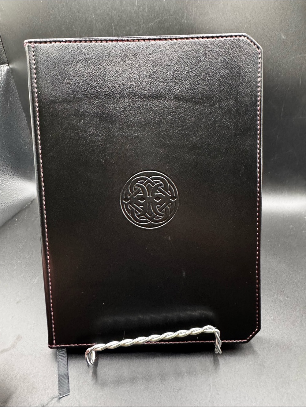 Franklin-Christoph Firma-Flex Notebook featuring a debossed circular Celtic knot